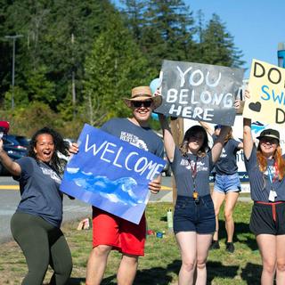 Residence Staff and Community welcoming new student during residence Orientation
