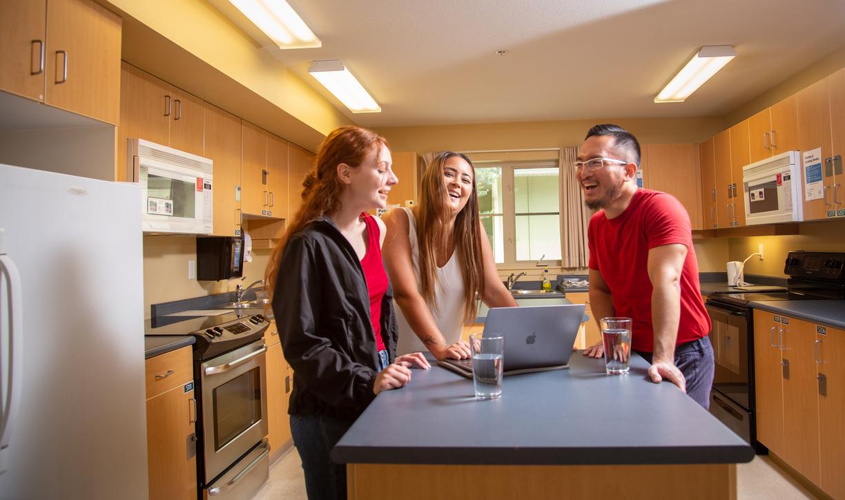 Students talking in a shared kitchen in student housing